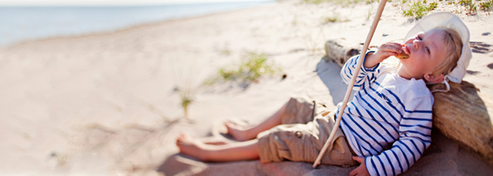 Child on sunny, sandy beach